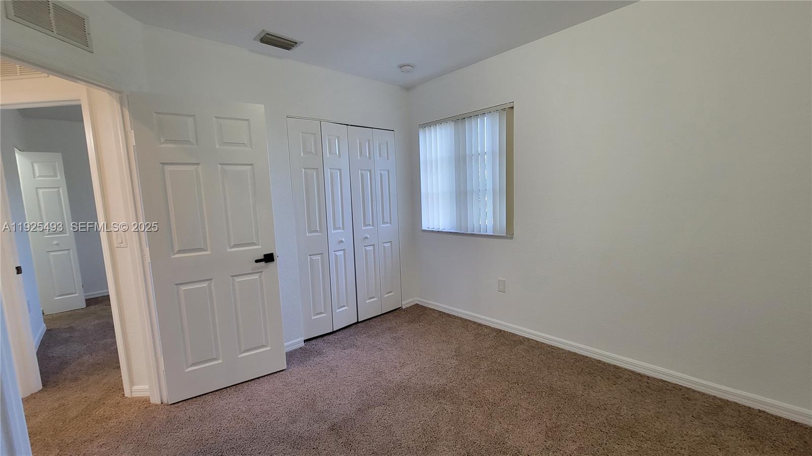 12600 Southwest 50th Court, Unit 437 Miramar, FL 33027 - Photo 16 of 24 an empty room with windows