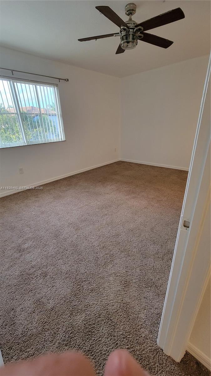 12600 Southwest 50th Court, Unit 437 Miramar, FL 33027 - Photo 19 of 24 an empty room with windows