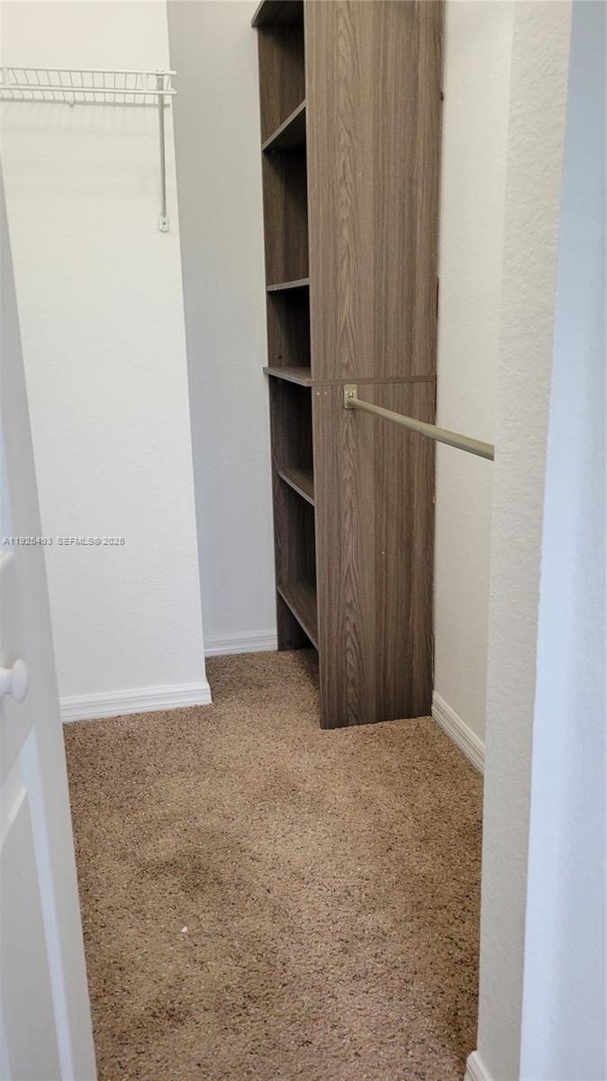 12600 Southwest 50th Court, Unit 437 Miramar, FL 33027 - Photo 20 of 24 a view of an empty walk in closet