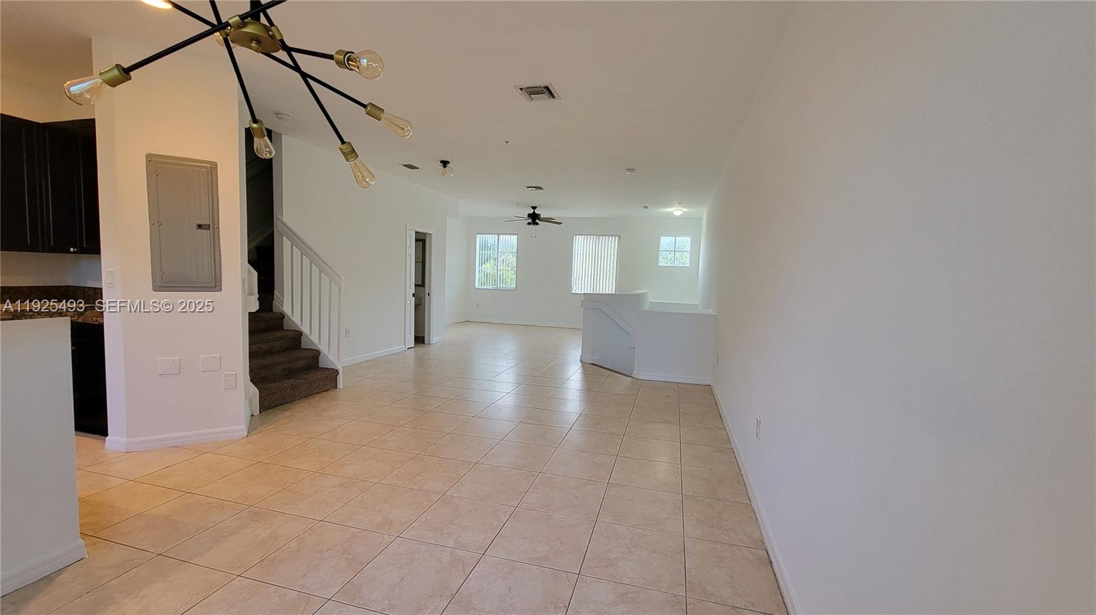 12600 Southwest 50th Court, Unit 437 Miramar, FL 33027 - Photo 8 of 24 a view of a living room with a fireplace