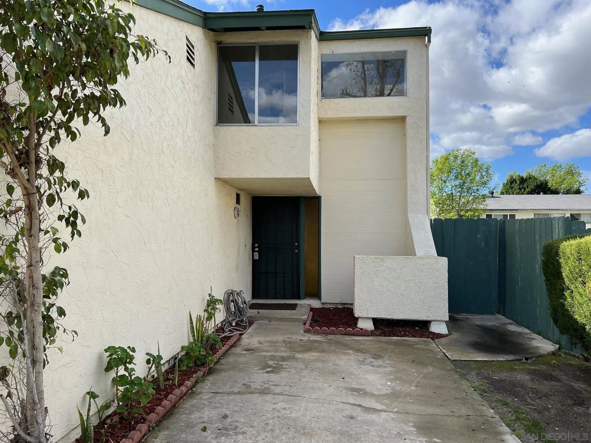 2018 Terracina Circle Spring Valley, CA 91977 - Photo 1 of 24 a couple of potted plants in front of door
