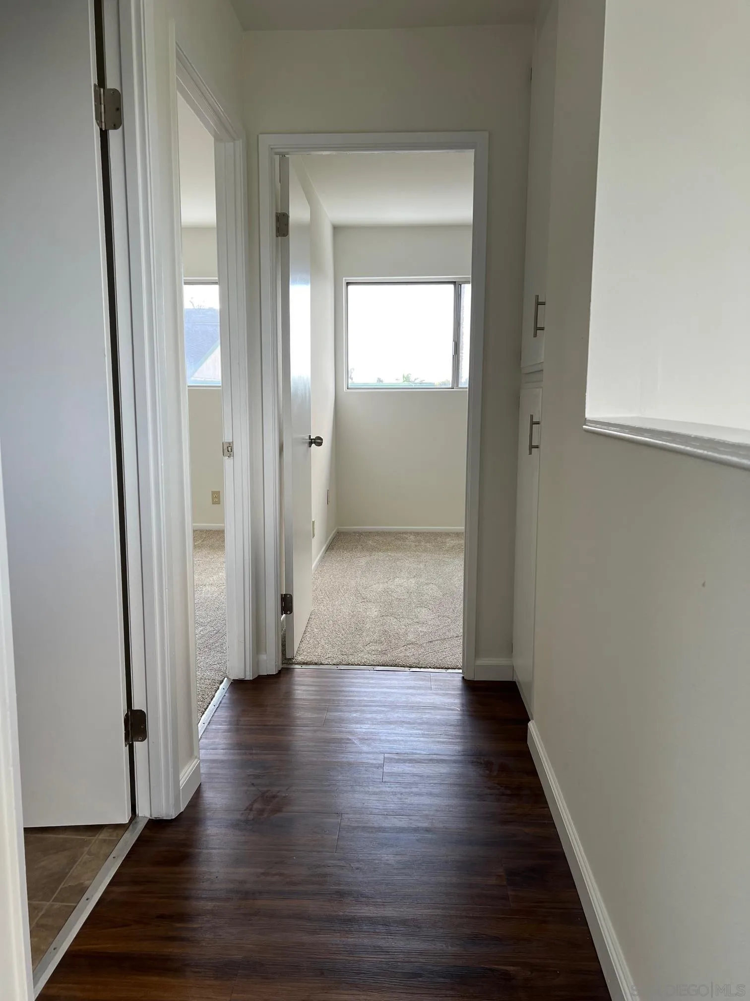 2018 Terracina Circle Spring Valley, CA 91977 - Photo 11 of 24 a view of a hallway with wooden floor
