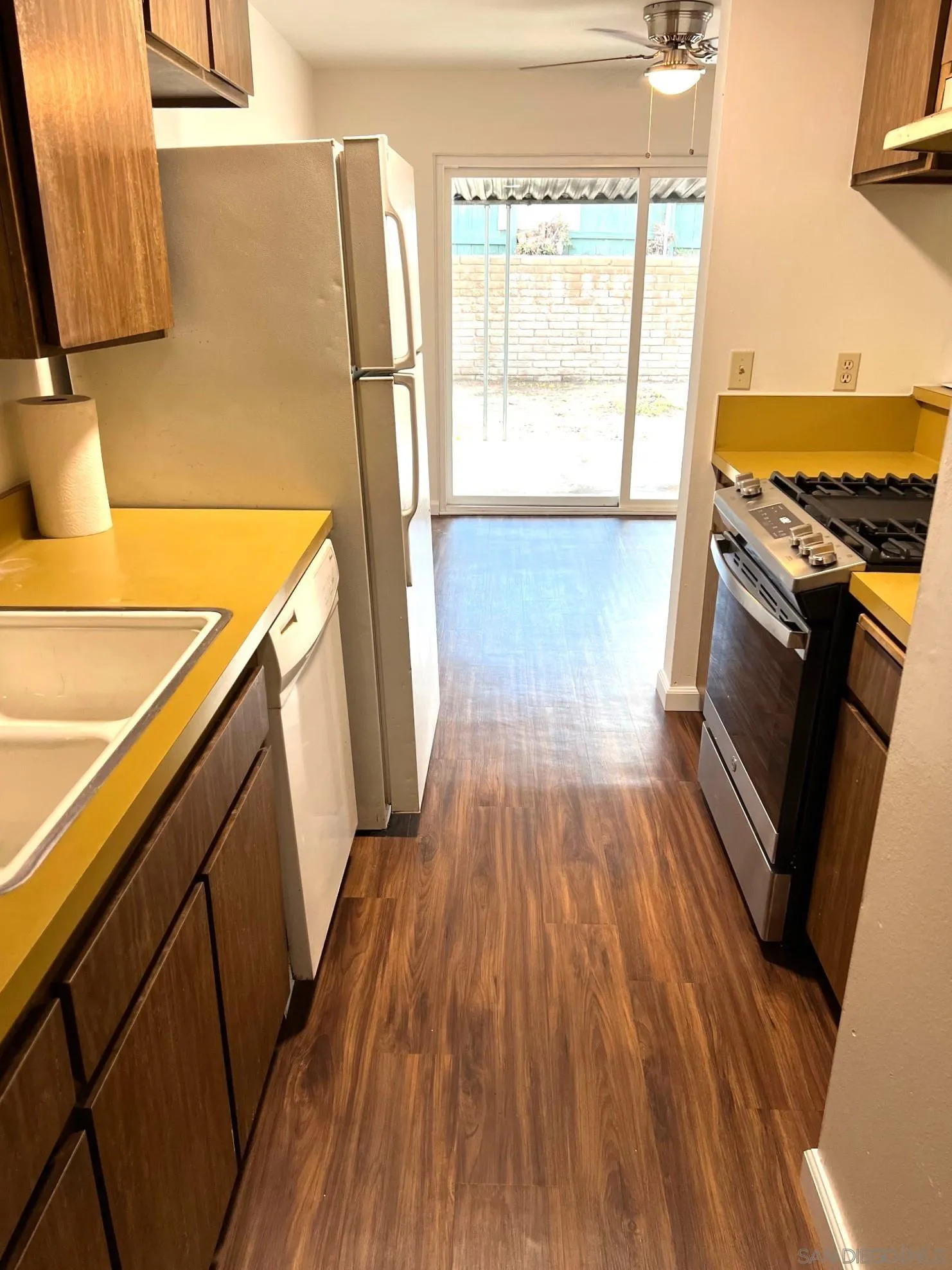 2018 Terracina Circle Spring Valley, CA 91977 - Photo 7 of 24 a view of a kitchen from a wooden floor