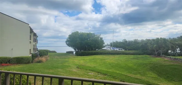 a view of a fountain in front of a house