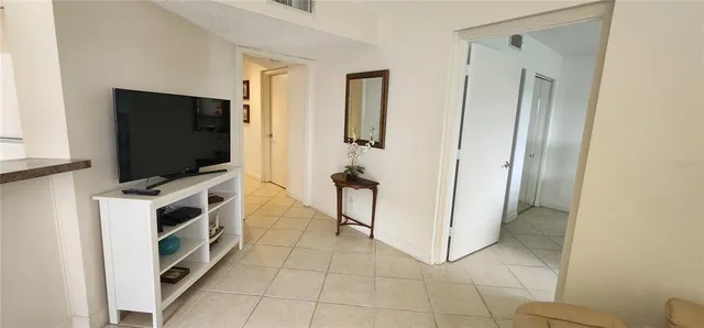 a living room with flat screen tv and washer