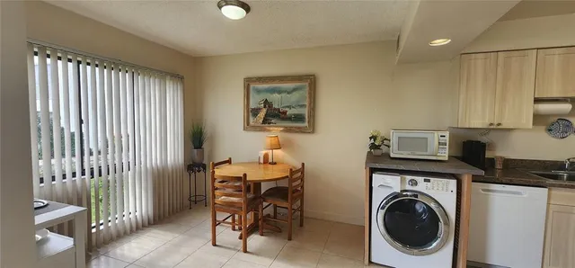 a view of kitchen and sink