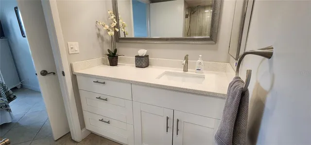 a bathroom with a sink and a mirror