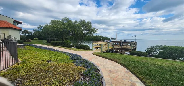 a view of a backyard with sitting area