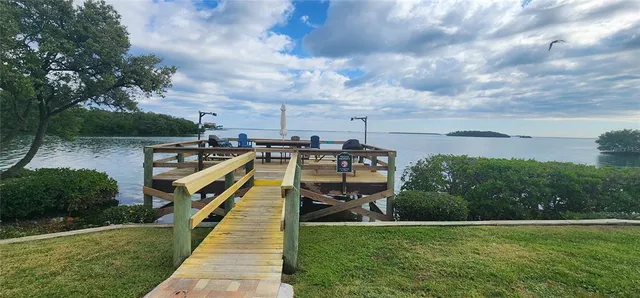 a view of a garden with lawn chairs
