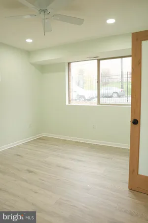 a view of an empty room with a window