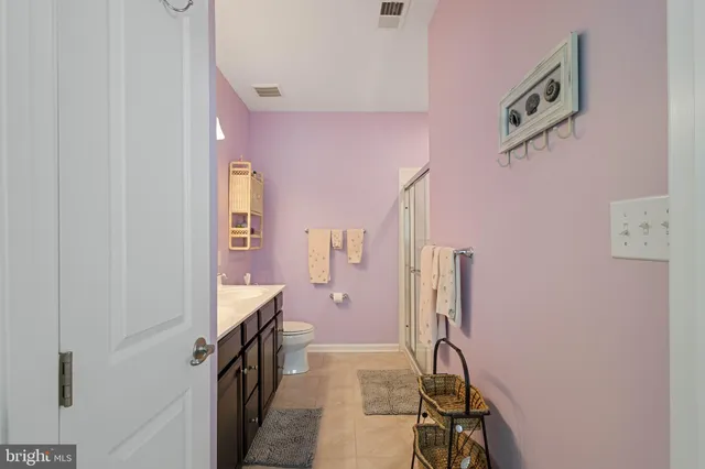 a view of a hallway with seating area