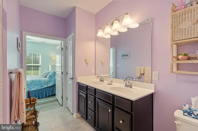 a spacious bathroom with a sink double vanity and a mirror