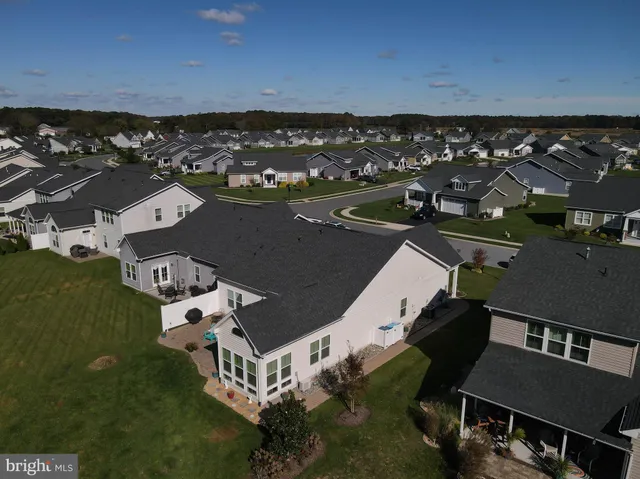 an aerial view of house with yard