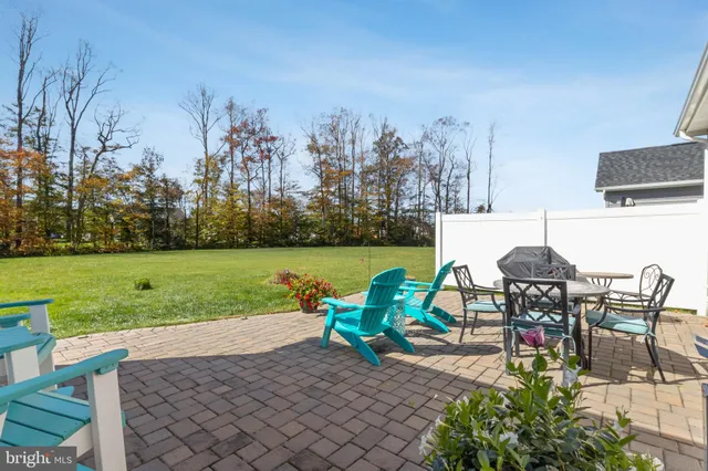an outdoor space with furniture and garden