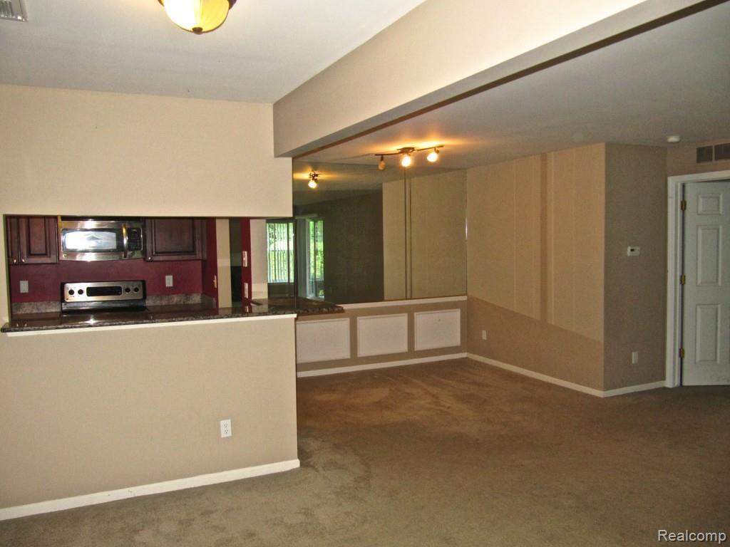 3397 Tremonte Circle, Unit 202 Rochester, MI 48306 - Photo 16 of 35 Great Room to Dining and Kitchen