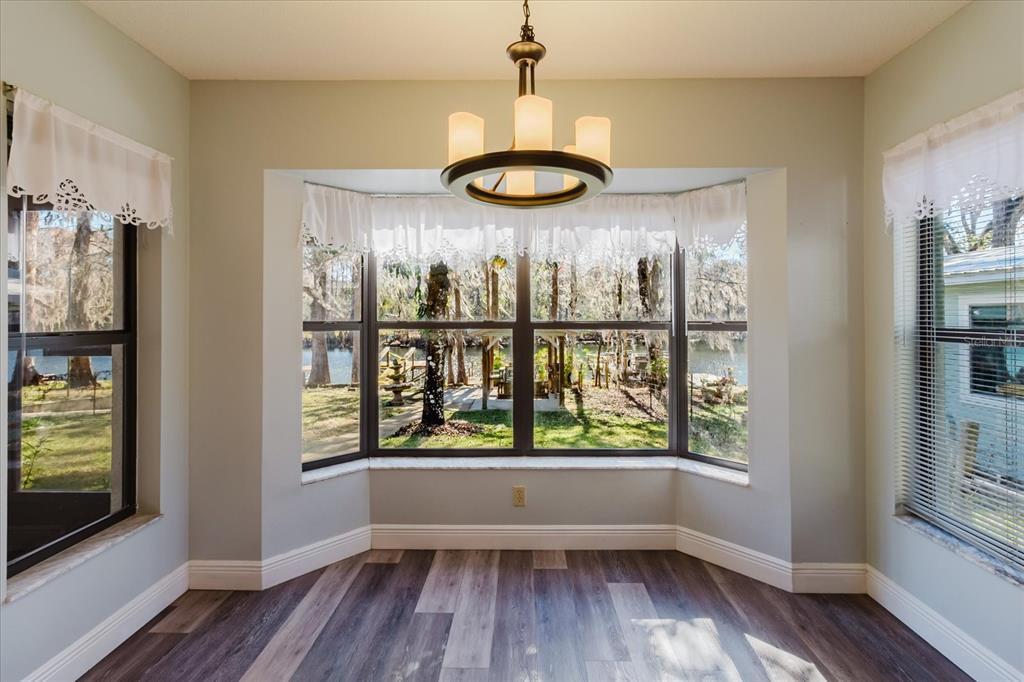 28330 Peterson Camp Road Brooksville, FL 34601 - Photo 25 of 81 a view of a room with wooden floor and a window