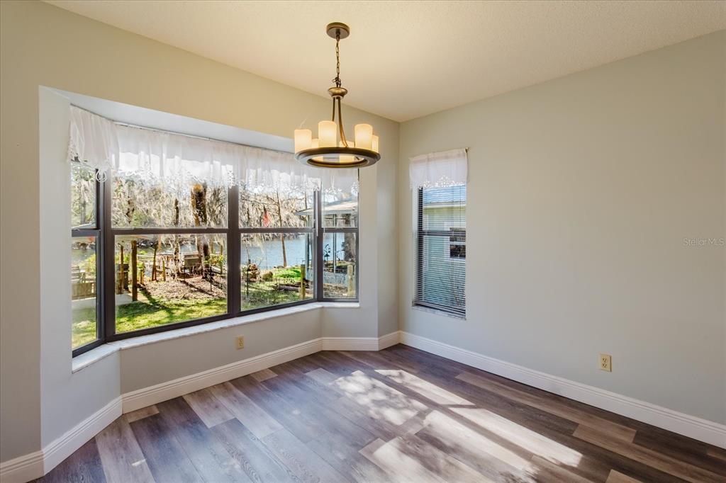 28330 Peterson Camp Road Brooksville, FL 34601 - Photo 26 of 81 a view of a room with window wooden floor and front door