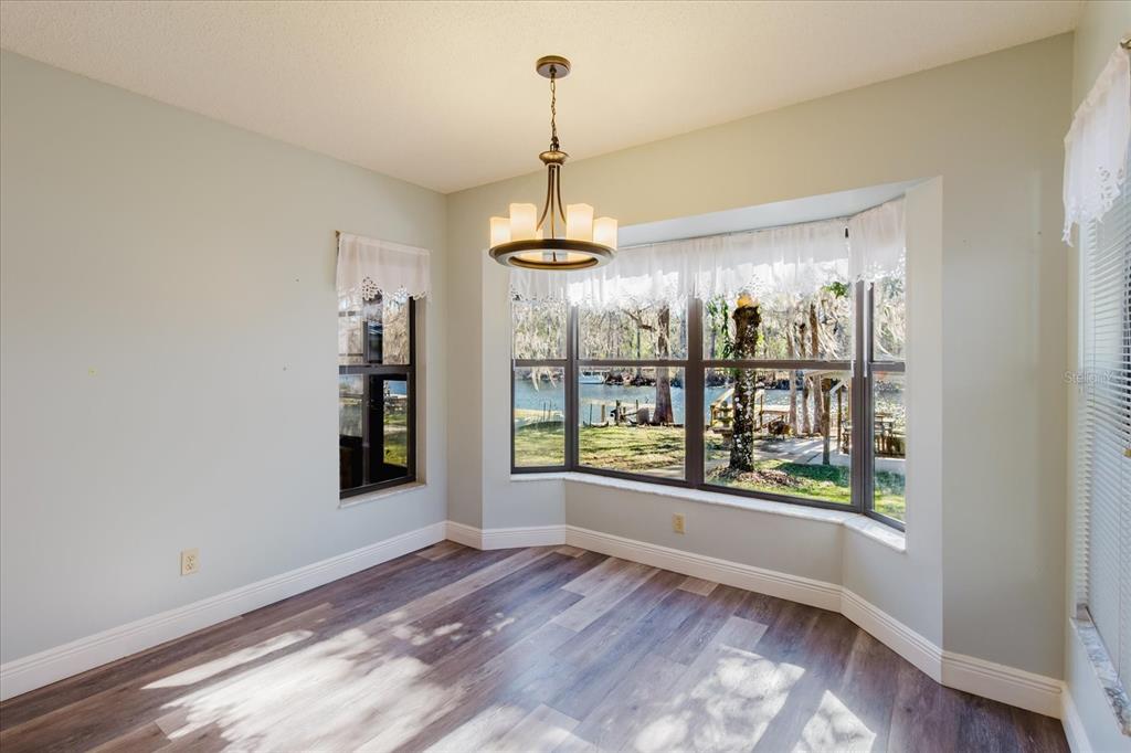 28330 Peterson Camp Road Brooksville, FL 34601 - Photo 27 of 81 a view of a room with window and chandelier