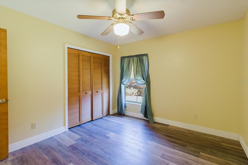 28330 Peterson Camp Road Brooksville, FL 34601 - Photo 38 of 81 wooden floor in an empty room