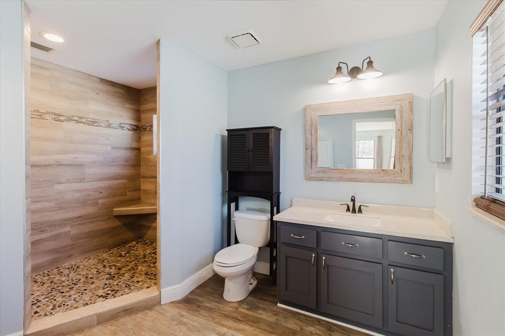 28330 Peterson Camp Road Brooksville, FL 34601 - Photo 45 of 81 a bathroom with a toilet sink and mirror