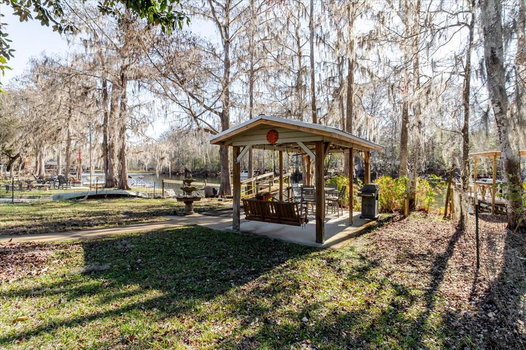 28330 Peterson Camp Road Brooksville, FL 34601 - Photo 67 of 81 a view of a town with trees and covered with wooden fence