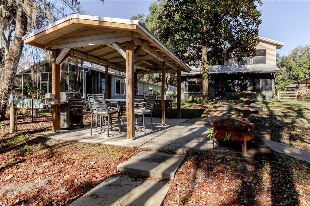 28330 Peterson Camp Road Brooksville, FL 34601 - Photo 69 of 81 a view of a chairs and table in the patio