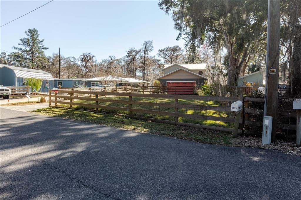 28330 Peterson Camp Road Brooksville, FL 34601 - Photo 71 of 81 a view of a house with a yard and large trees