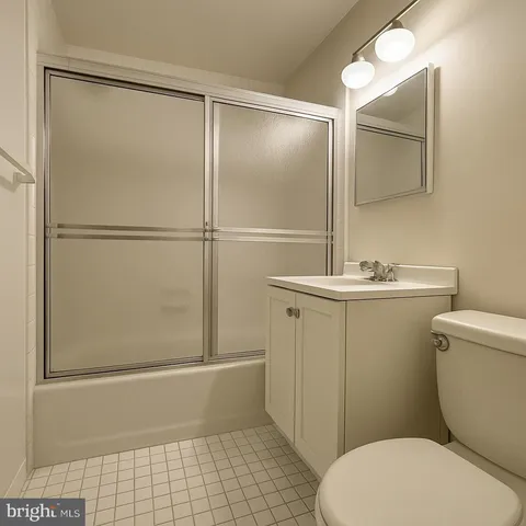 a bathroom with a toilet a sink and shower