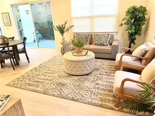 a living room with furniture and a rug