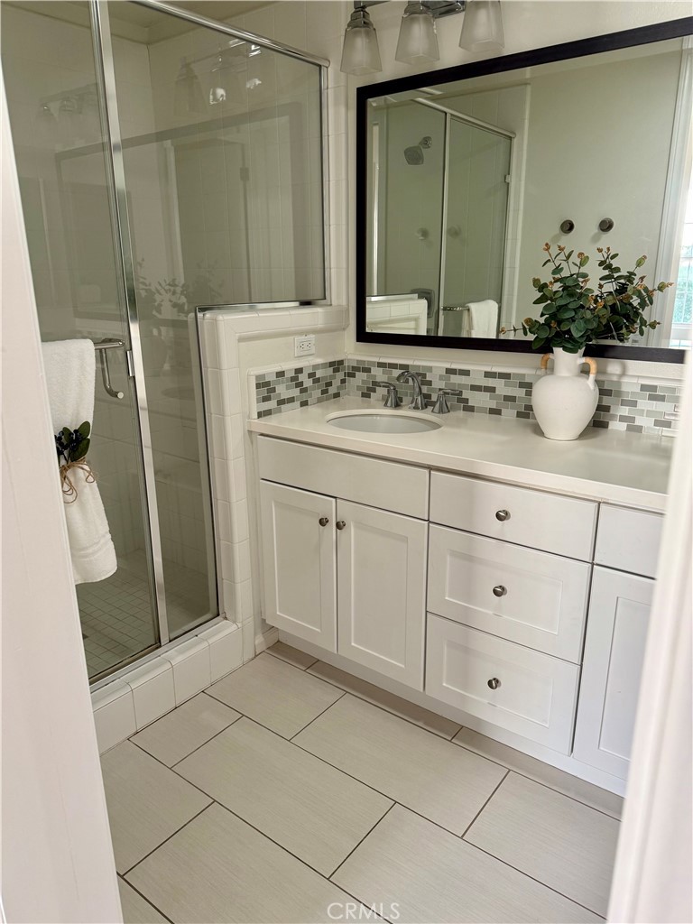 93 Painted Trellis Irvine, CA 92620 - Photo 12 of 12 a bathroom with a sink and a mirror