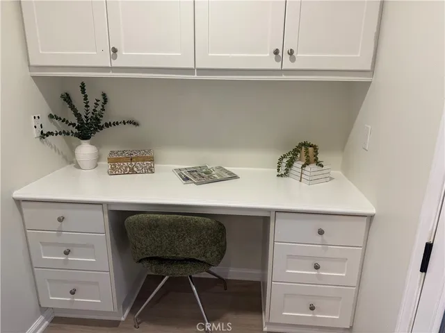 a bathroom with a sink mirror and toilet