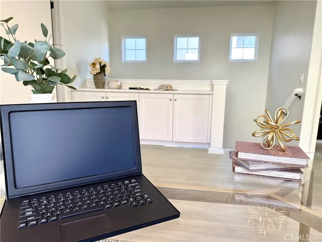 a bedroom with a bed and painting on the wall