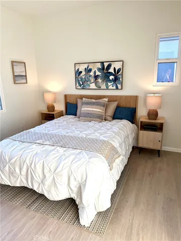 a bedroom with a bed and a couch