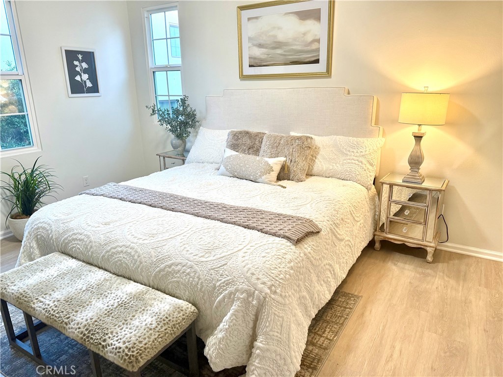 93 Painted Trellis Irvine, CA 92620 - Photo 9 of 12 a bedroom with a bed and a couch