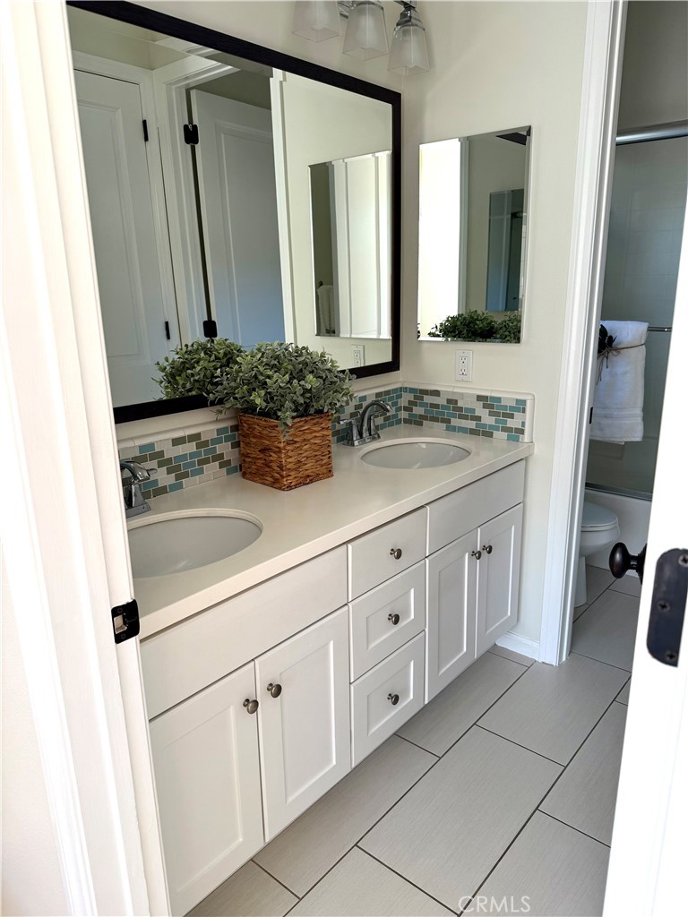 93 Painted Trellis Irvine, CA 92620 - Photo 10 of 12 a bathroom with a sink and a mirror