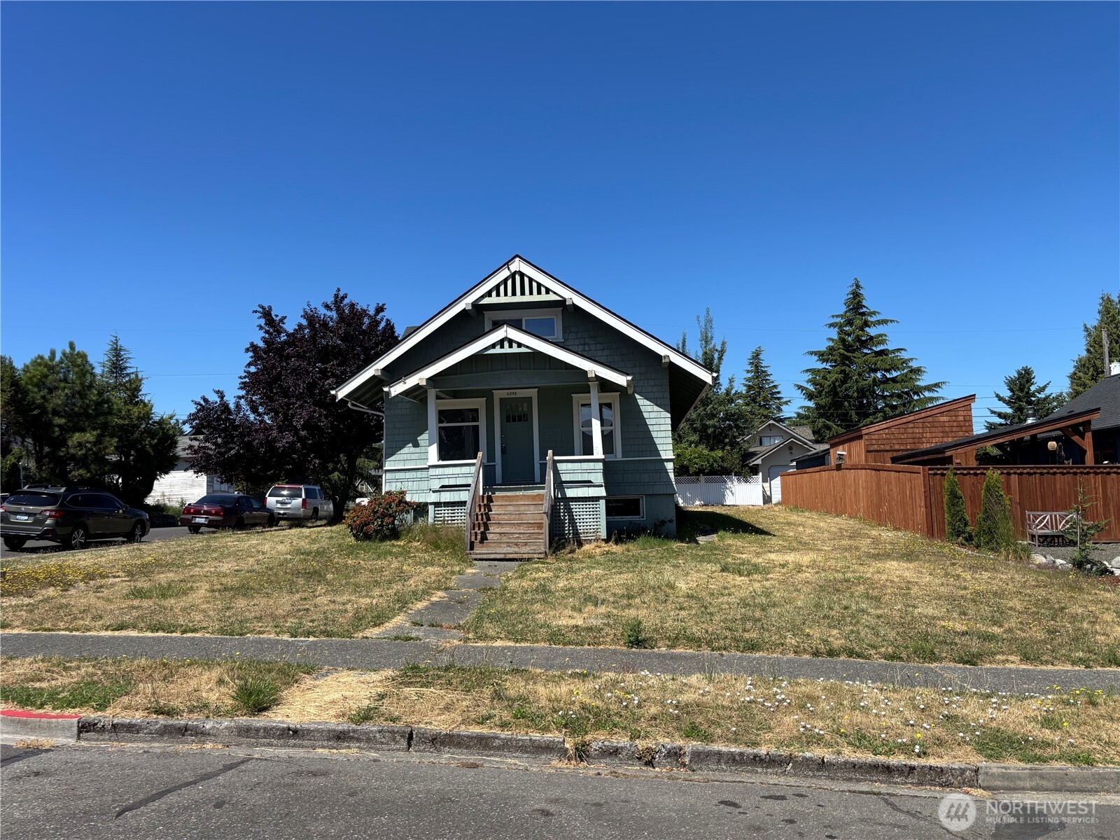5302 North Shirley Street Ruston, WA 98407 - Photo 2 of 10 a view of a house with a yard