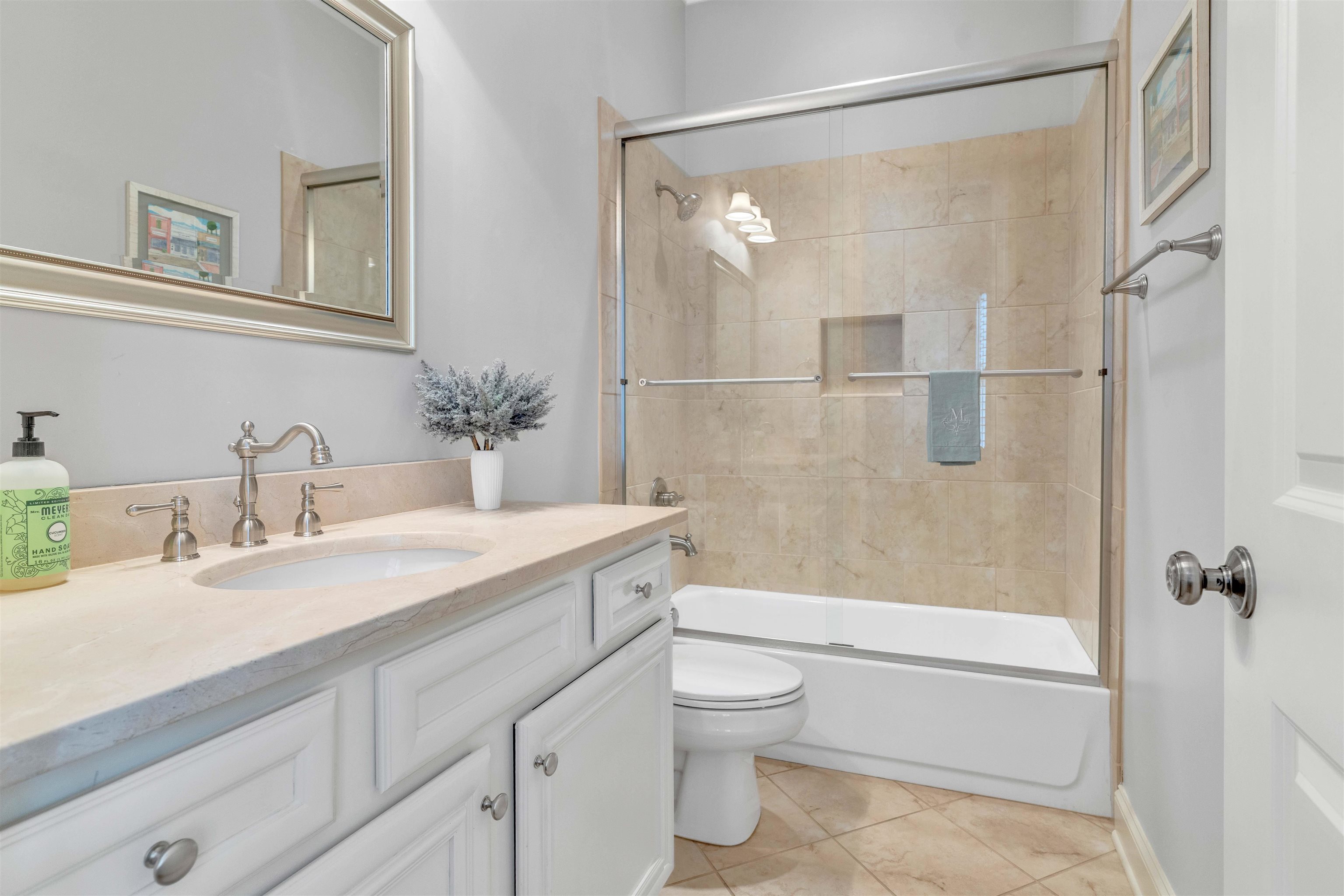 528 Althea Lane Collierville, TN 38017 - Photo 20 of 36 Bathroom featuring vanity, bath / shower combo with glass door, and light tile patterned floors