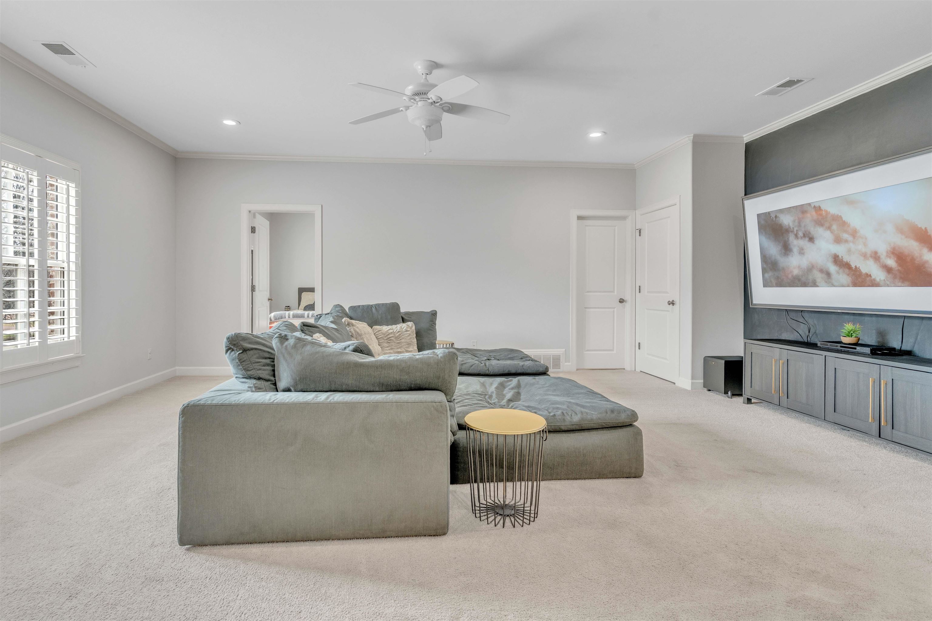 528 Althea Lane Collierville, TN 38017 - Photo 21 of 36 Living room featuring ceiling fan, ornamental molding, light colored carpet, and recessed lighting