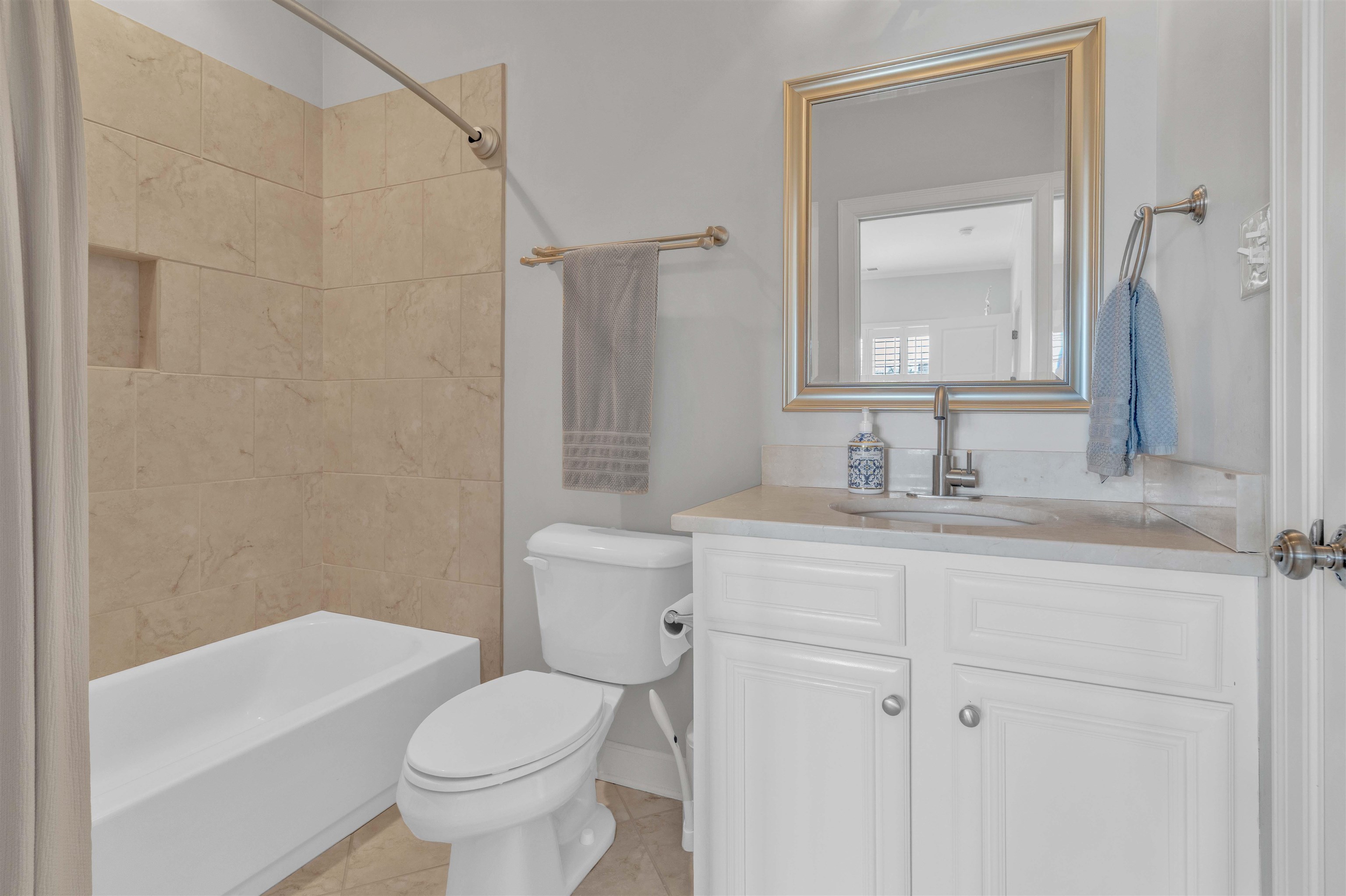 528 Althea Lane Collierville, TN 38017 - Photo 24 of 36 Bathroom with vanity, shower / bathtub combination, and light tile patterned flooring