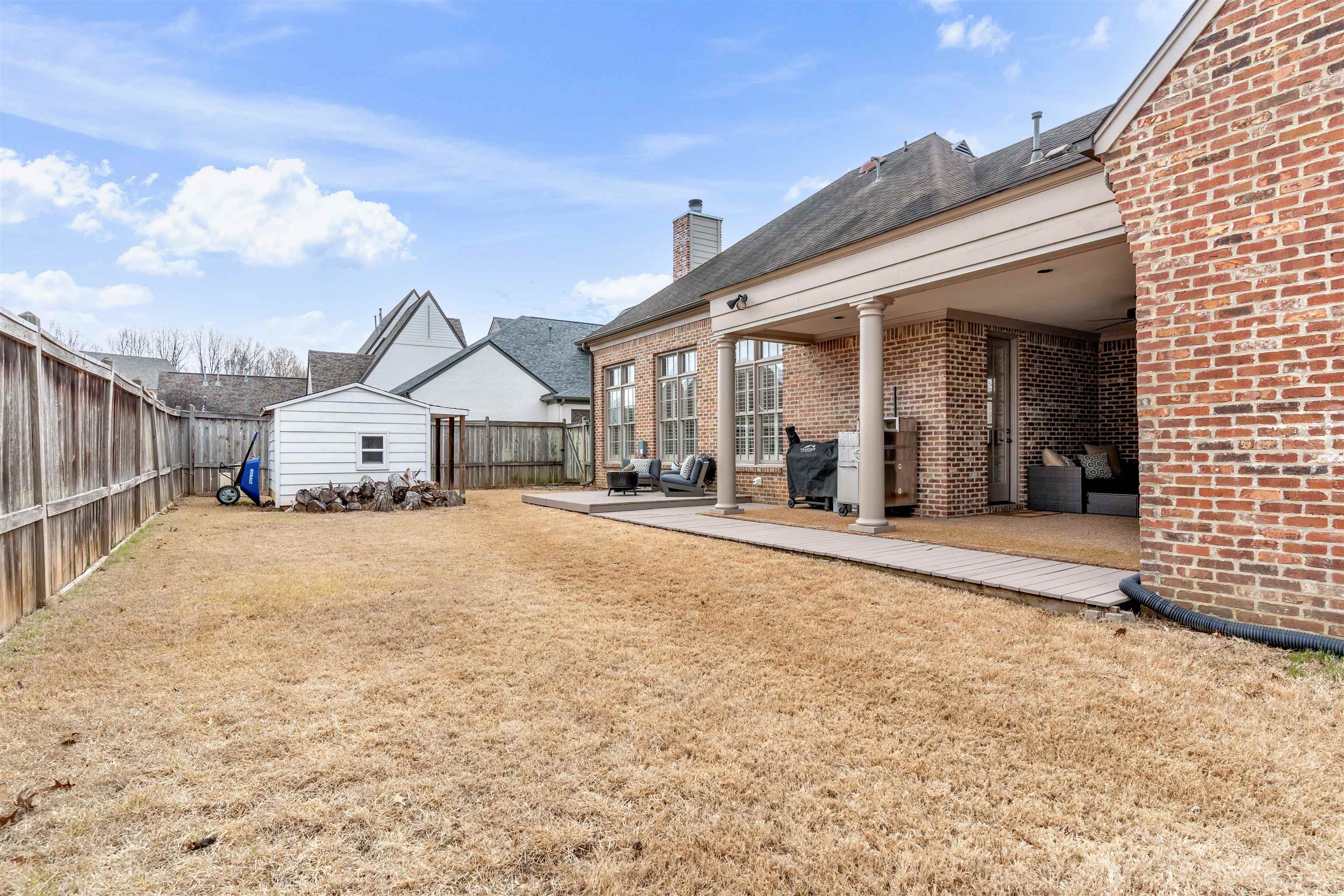 528 Althea Lane Collierville, TN 38017 - Photo 29 of 36 Fenced backyard featuring an outdoor structure and a patio area