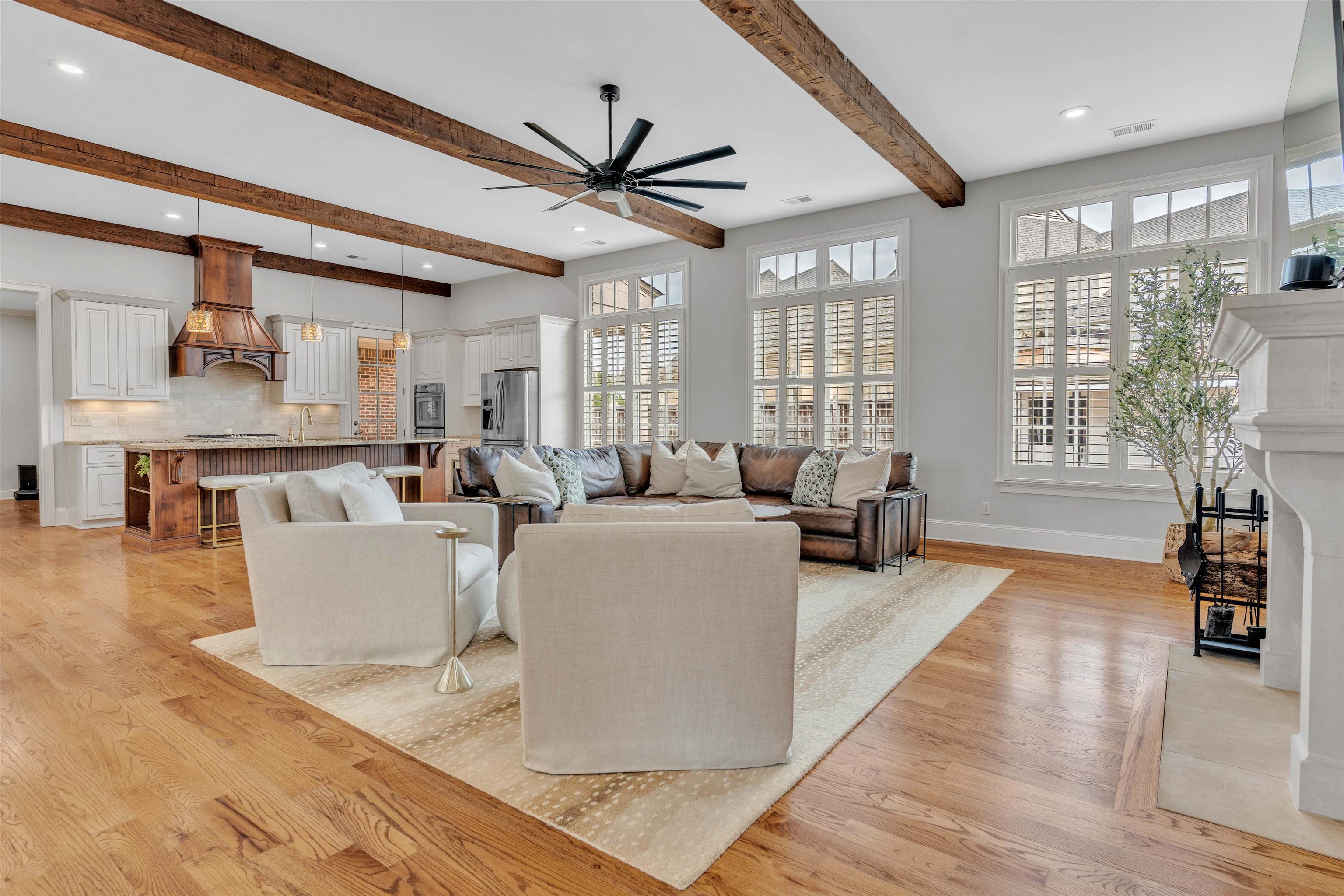 528 Althea Lane Collierville, TN 38017 - Photo 3 of 36 Living room with light wood-type flooring, a fireplace, a ceiling fan, beam ceiling, and recessed lighting