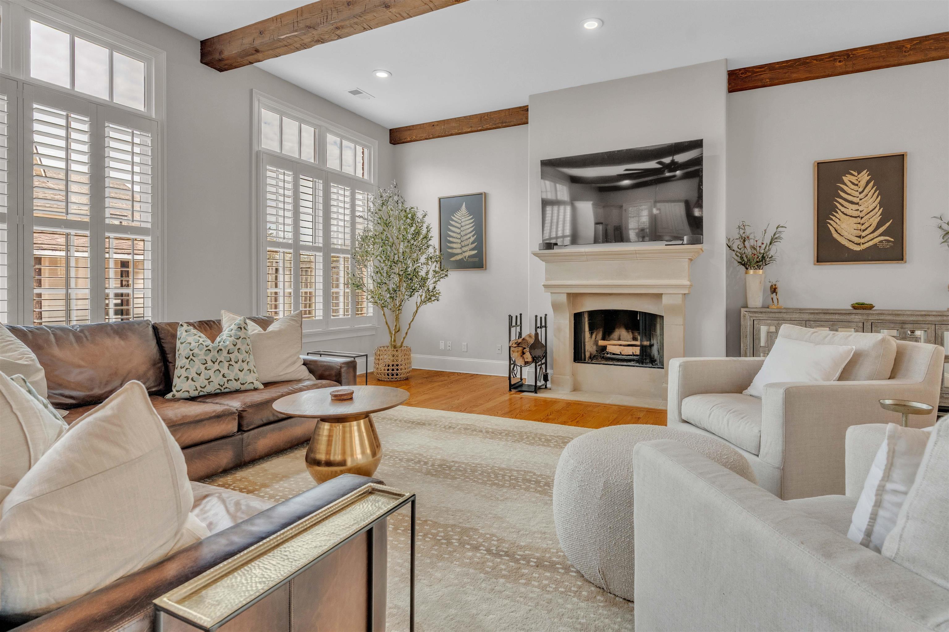528 Althea Lane Collierville, TN 38017 - Photo 4 of 36 Living room featuring beam ceiling, recessed lighting, light wood-type flooring, and a fireplace with flush hearth