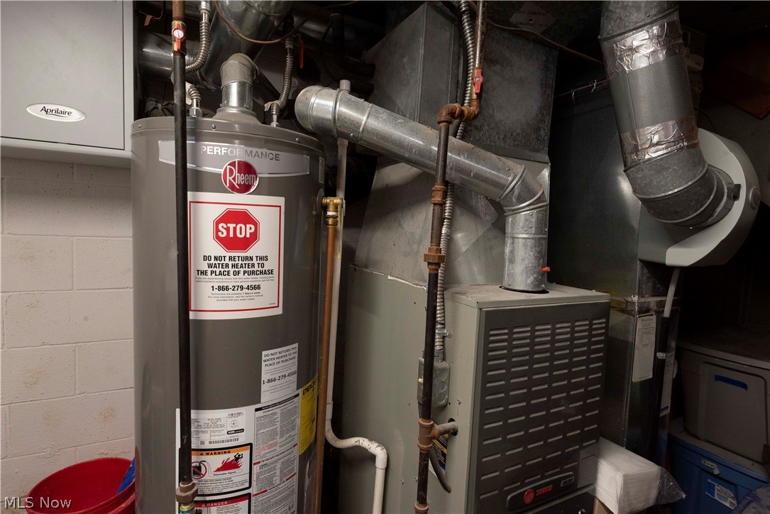 400 Baldwin Road Akron, OH 44312 - Photo 36 of 43 Water heater and Trane furnace, with visible ductwork and copper piping