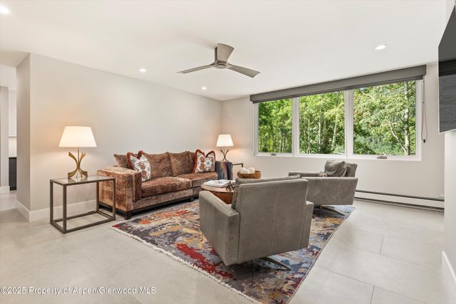 a view of a backyard with sitting area