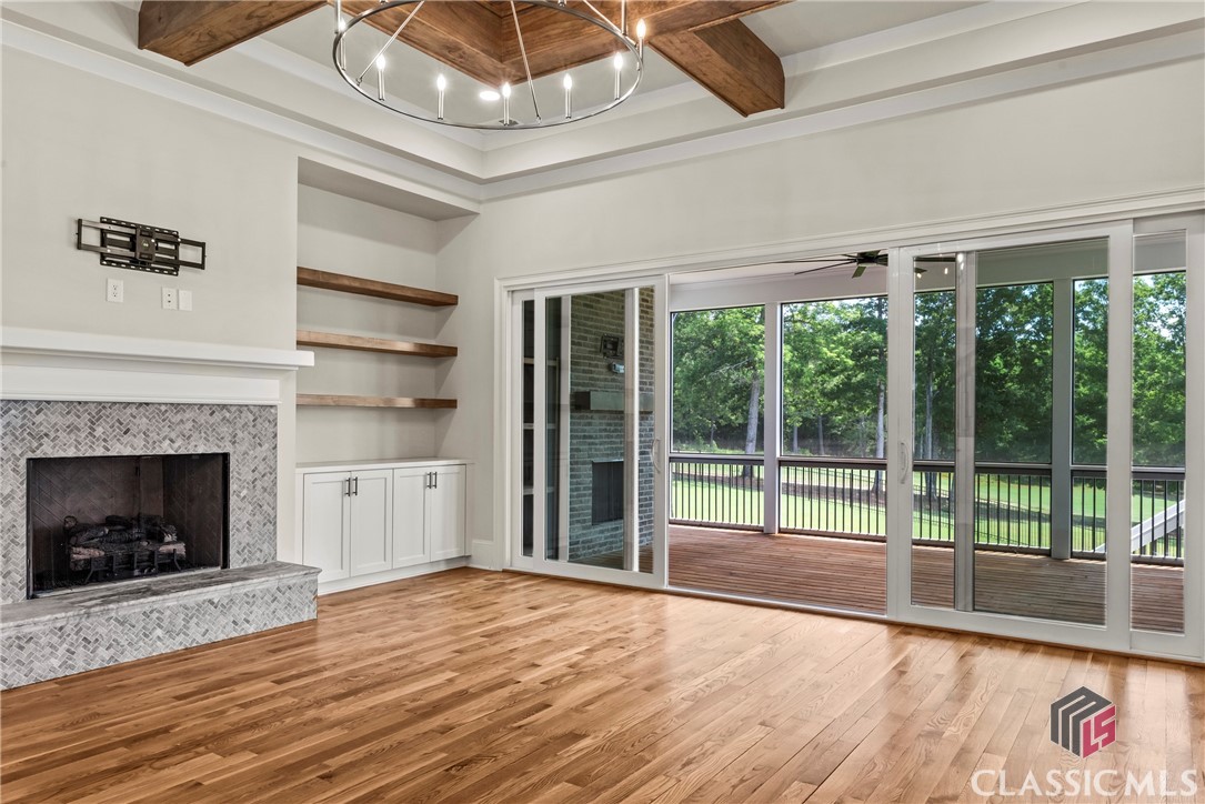 902 Indigo Bunting Road Statham, GA 30666 - Photo 7 of 50 Great Room with wall of glass doors for views