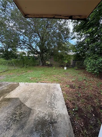 a view of a backyard with green space