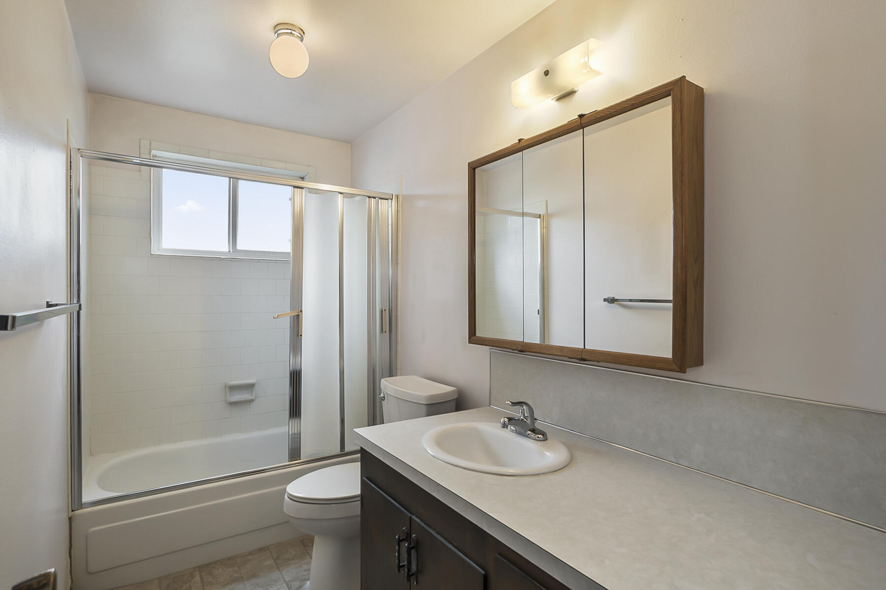61825 Dobbin Road Bend, OR 97702 - Photo 18 of 43 a bathroom with a sink a toilet and shower