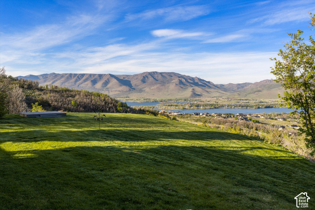 5878 Snowbasin Road Huntsville, UT 84317 - Photo 58 of 90 Expansive green lawn with mountain and lake scenery