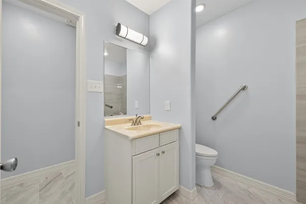 a bathroom with a sink and a large mirror