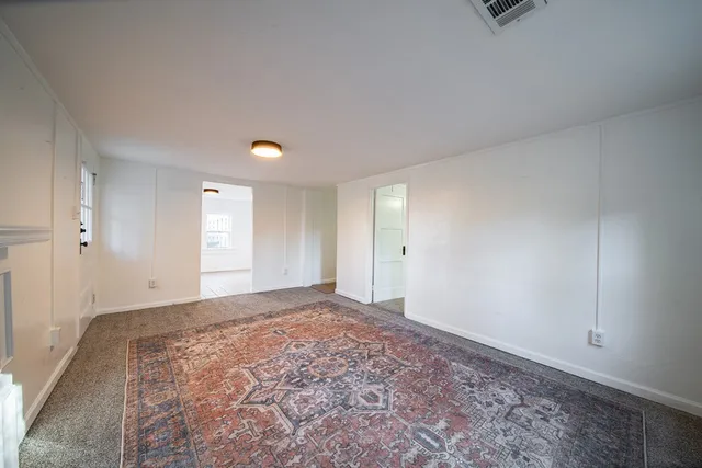 a view of an empty room and window